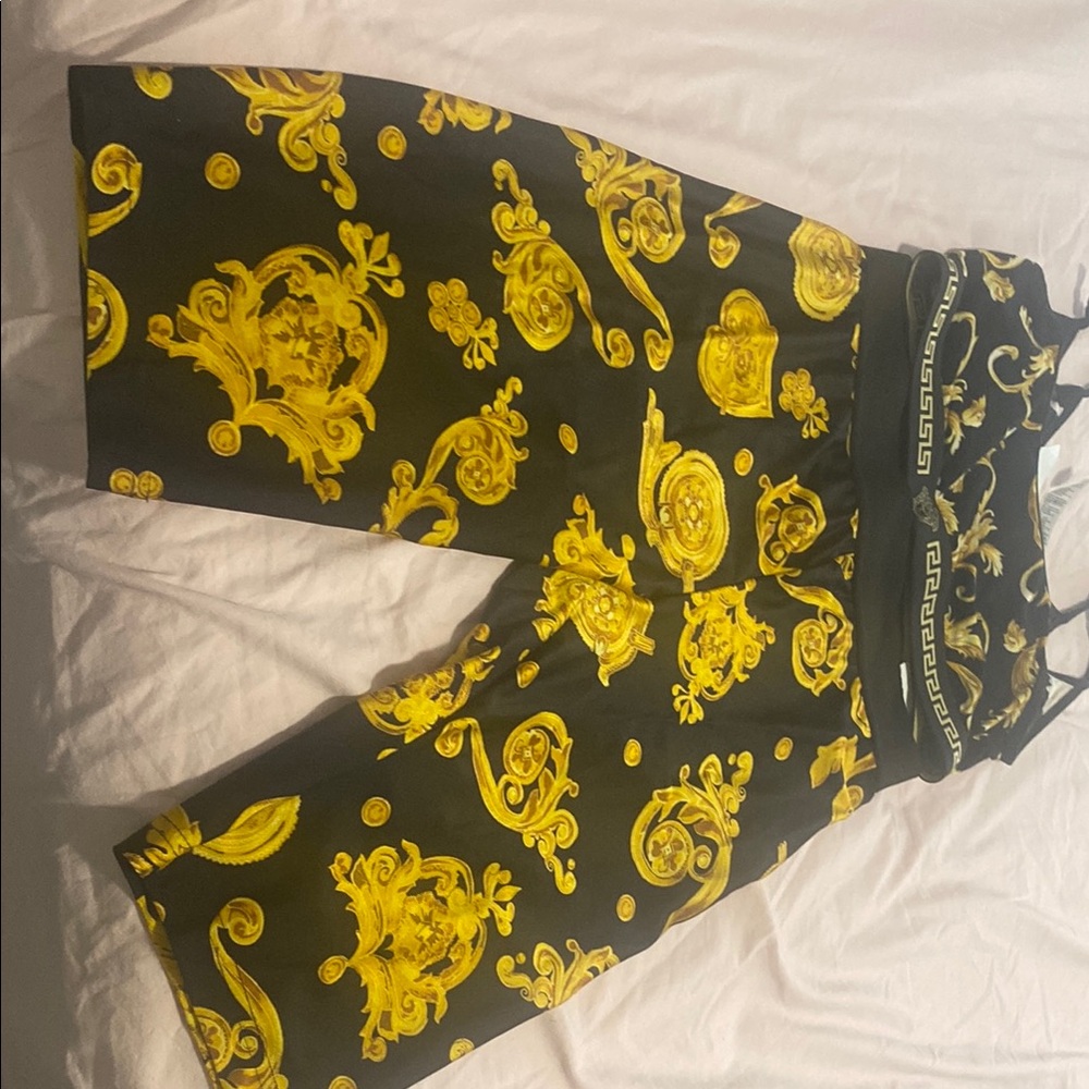 Versace Black and Gold set pants is a small that has a lot of stretch